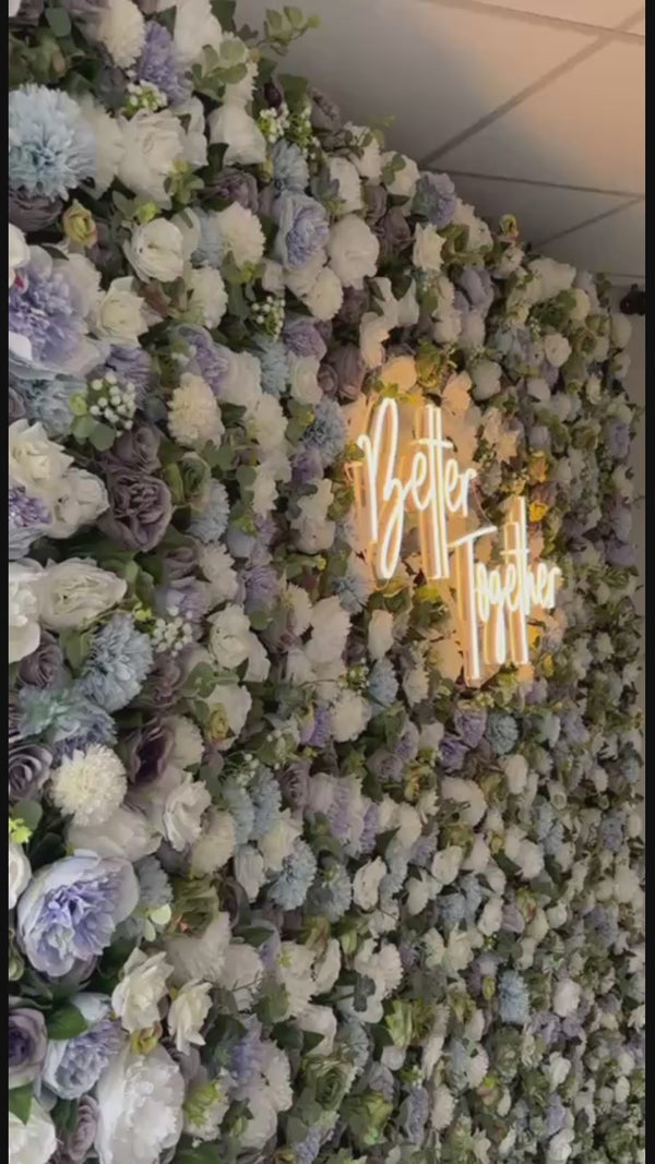 LED neon signs paired with luxury flower walls – elegant event backdrop solution for weddings, parties, and brand activations in the UK.